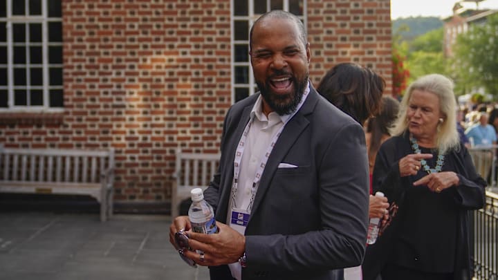 Jul 20, 2024; Cooperstown, New York, USA; Hall of Fame member Barry Larkin reacts as he arrives at the National Baseball Hall of Fame during the Parade of Legends in Cooperstown, NY. Mandatory Credit: Gregory Fisher-Imagn Images
