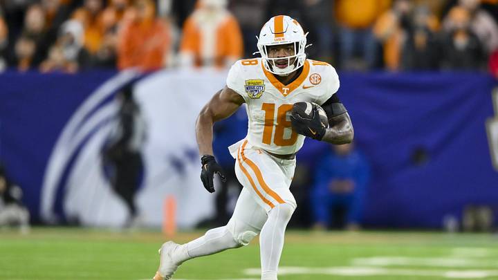 Dec 30, 2025; Nashville, TN, USA; Tennessee Volunteers running back Desean Bishop (18) runs with the ball after a made catch against the Illinois Fighting Illini during the first half at Nissan Stadium. Mandatory Credit: Steve Roberts-Imagn Images