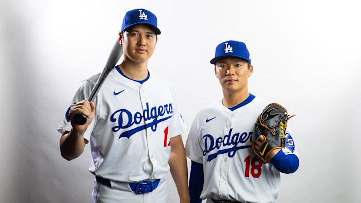 Feb 21, 2024; Glendale, AZ, USA; Los Angeles Dodgers designated hitter Shohei Ohtani (left) and pitcher Yoshinobu Yamamoto pose for a portrait during media day at Camelback Ranch. Mandatory Credit: Mark J. Rebilas-USA TODAY Sports