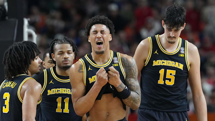 Michigan Wolverines forward Yaxel Lendeborg (23) reacts to an injury Saturday, April 4, 2026, during a Final Four game against the Arizona Wildcats at Lucas Oil Stadium in Indianapolis.
