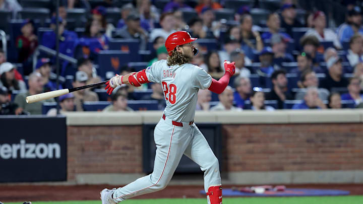 Sep 20, 2024; New York City, New York, USA; Philadelphia Phillies third baseman Alec Bohm (28) follows through on a three-run home run against the New York Mets during the fourth inning at Citi Field. Mandatory Credit: Brad Penner-Imagn Images