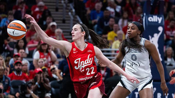 Aug 6, 2026; Indianapolis, Indiana, USA; Indiana Fever guard Caitlin Clark (22) vies for a loose ball against Las Vegas Aces guard Jackie Young (0) in the second half at Gainbridge Fieldhouse. Mandatory Credit: Trevor Ruszkowski-Imagn Images Aug 6, 2026; Indianapolis, Indiana, USA; Indiana Fever guard Caitlin Clark (22) vies for a loose ball against Las Vegas Aces guard Jackie Young (0) in the second half at Gainbridge Fieldhouse. Mandatory Credit: Trevor Ruszkowski-Imagn Images