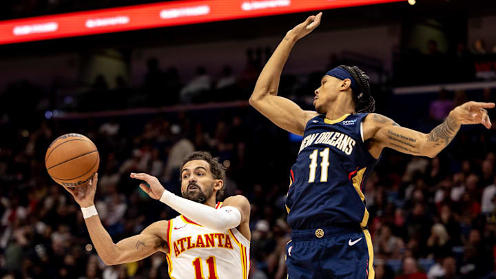 Nov 3, 2024; New Orleans, Louisiana, USA;  Atlanta Hawks guard Trae Young (11) passes the ball against New Orleans Pelicans guard Brandon Boston Jr. (11) during the first half at Smoothie King Center. Mandatory Credit: Stephen Lew-Imagn Images