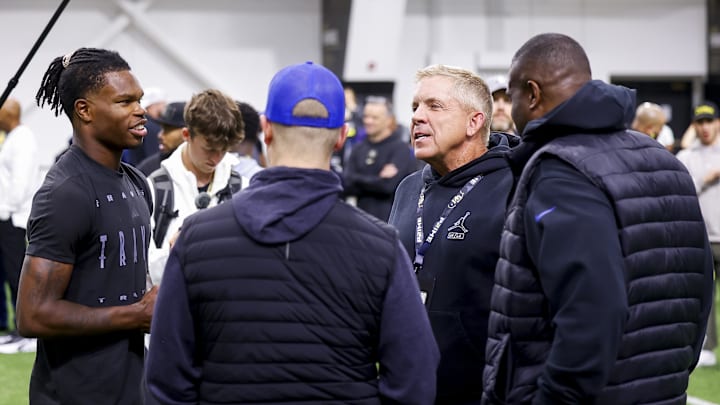 Apr 4, 2025; Boulder, CO, USA; Colorado Buffaloes wide receiver Travis Hunter (12) talks to Denver Broncos head coach Sean Payton after the University of Colorado NFL Showcase at the CU Indoor Practice Facility. 