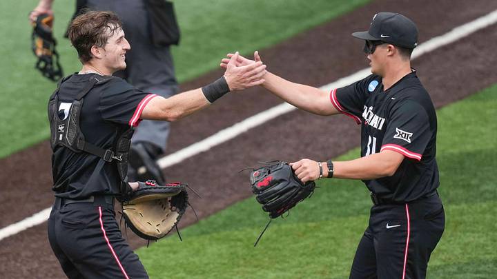 Cincinnati catcher Jack Natili (7) and Cincinnati outfielder Cal Sefcik (21) celebrate after winning a NCAA regional baseball game between Cincinnati and Wake Forest at Lindsey Nelson Stadium in Knoxville, Tenn., on May 30, 2025.