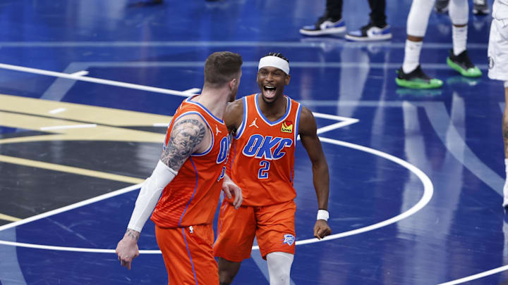 Dec 10, 2024; Oklahoma City, Oklahoma, USA; Oklahoma City Thunder guard Shai Gilgeous-Alexander (2) celebrates with center Isaiah Hartenstein (55) after he dunks against the Dallas Mavericks during the third quarter at Paycom Center. Mandatory Credit: Alonzo Adams-Imagn Images