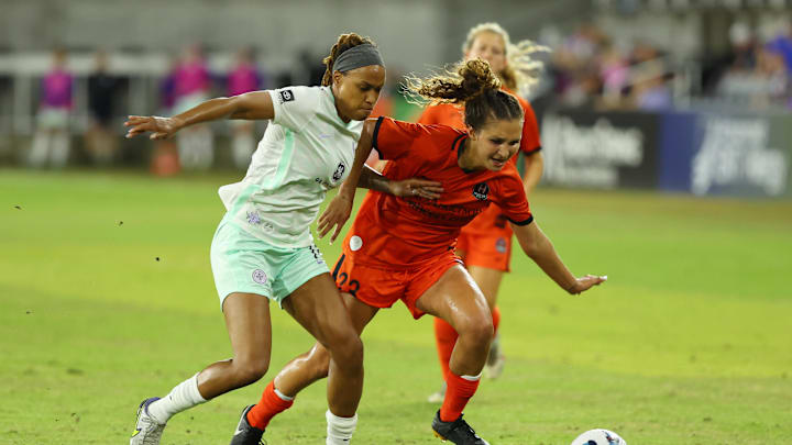 May 14, 2022; Louisville, Kentucky, USA; Racing Louisville FC player Jess McDonald (14) and Houston