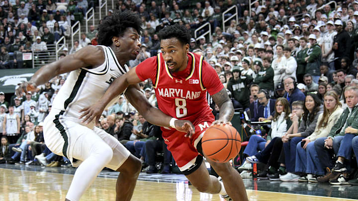 Maryland Terrapins guard David Coit (8) drives past Michigan State Spartans forward Cameron Ward (3) Maryland Terrapins guard David Coit (8) drives past Michigan State Spartans forward Cameron Ward (3)