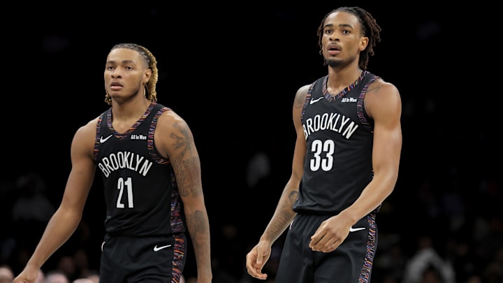 Jan 9, 2026; Brooklyn, New York, USA; Brooklyn Nets forward Noah Clowney (21) and center Nic Claxton (33) react during the fourth quarter against the Los Angeles Clippers at Barclays Center. Mandatory Credit: Brad Penner-Imagn Images