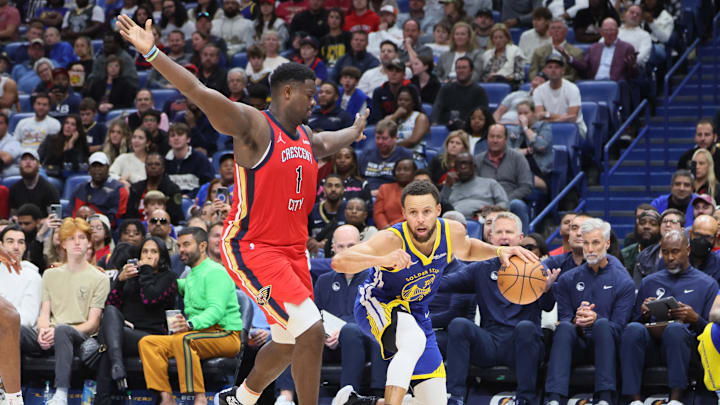 Oct 30, 2023; New Orleans, Louisiana, USA; Golden State Warriors guard Stephen Curry (30) is defended by New Orleans Pelicans forward Zion Williamson (1) in fourth quarter action at Smoothie King Center. Mandatory Credit: Matthew Dobbins-Imagn Images