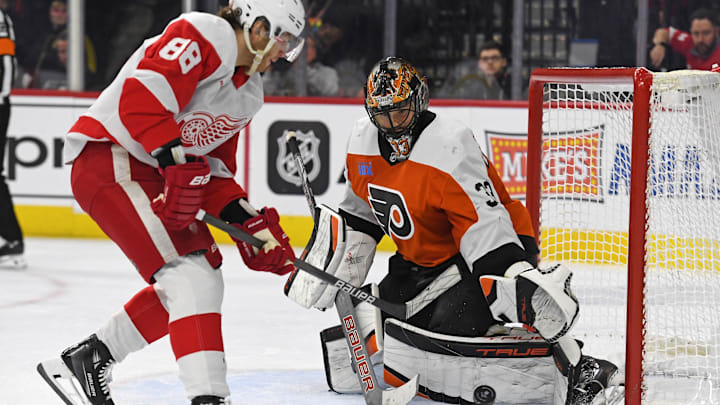 Jan 21, 2025; Philadelphia, Pennsylvania, USA; Philadelphia Flyers goaltender Samuel Ersson (33) makes a save against Detroit Red Wings right wing Patrick Kane (88) during the overtime period at Wells Fargo Center. Mandatory Credit: Eric Hartline-Imagn Images Jan 21, 2025; Philadelphia, Pennsylvania, USA; Philadelphia Flyers goaltender Samuel Ersson (33) makes a save against Detroit Red Wings right wing Patrick Kane (88) during the overtime period at Wells Fargo Center. Mandatory Credit: Eric Hartline-Imagn Images
