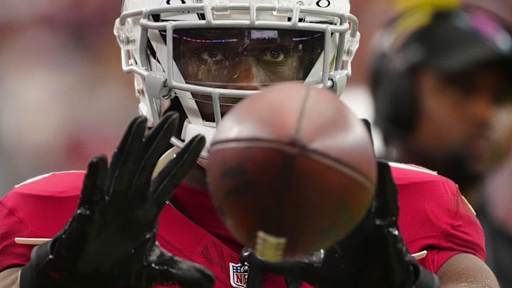 Cardinals wide receiver Marvin Harrison Jr. (18) catches a pass on the sideline during a game at State Farm Stadium in Glendale on Sept. 29, 2024. Cardinals wide receiver Marvin Harrison Jr. (18) catches a pass on the sideline during a game at State Farm Stadium in Glendale on Sept. 29, 2024.