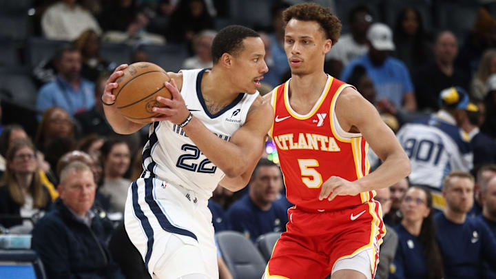 Mar 3, 2025; Memphis, Tennessee, USA; Memphis Grizzlies guard Desmond Bane (22) handles the ball as Atlanta Hawks guard Dyson Daniels (5) defends during the first quarter at FedExForum. Mandatory Credit: Petre Thomas-Imagn Images