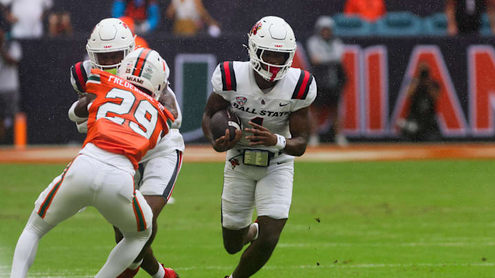 Sep 14, 2024; Miami Gardens, Florida, USA; Ball State Cardinals wide receiver Justin Bowick (1) runs with the football against the Miami Hurricanes during the first quarter at Hard Rock Stadium. Mandatory Credit: Sam Navarro-Imagn Images