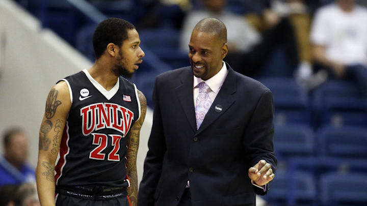 Former UNLV Rebels assistant coach Stacey Augmon (right) talks with guard Jelan Kendrick (22) during the second half against the Air Force Falcons at Clune Arena. The Falcons won 76-75. 