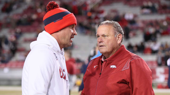 Ole Miss Rebels head coach Lane Kiffin talks to Arkansas Razorbacks head coach Sam Pittman prior to the game at Donald W. Reynolds Razorback Stadium. 