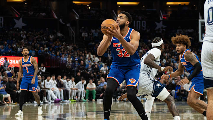 Dec 15, 2024; Orlando, Florida, USA; New York Knicks center Karl-Anthony Towns (32) shoots the ball against the Orlando Magic  in the second quarter at Kia Center. Mandatory Credit: Jeremy Reper-Imagn Images