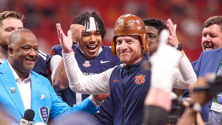 Auburn Tigers head coach Alex Golesh wears the old leather helmet after a victory over the Baylor Bears at Mercedes-Benz Stadium. Mandatory Credit: Brett Davis-Imagn Images Auburn Tigers head coach Alex Golesh wears the old leather helmet after a victory over the Baylor Bears at Mercedes-Benz Stadium. Mandatory Credit: Brett Davis-Imagn Images
