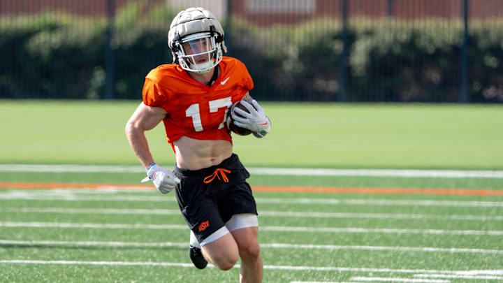 Gavin Freeman (17) runs drills during an Oklahoma State football practice in Stillwater, Okla., on Saturday, Aug. 3, 2024.