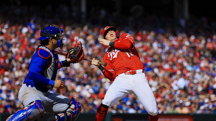 May 24, 2025; Cincinnati, Ohio, USA; Cincinnati Reds designated hitter Austin Hays (12) dodges a pitch in the fifth inning against the Chicago Cubs at Great American Ball Park. Mandatory Credit: Katie Stratman-Imagn Images