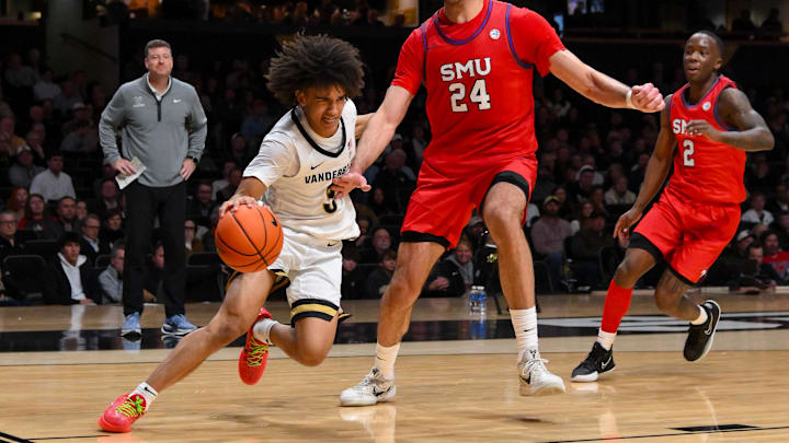 Dec 3, 2025; Nashville, Tennessee, USA; Vanderbilt Commodores guard Tyler Tanner (3) drives baseline past Southern Methodist University Mustangs center Samet Yigitoglu (24) during the second half at Memorial Gymnasium. Mandatory Credit: Steve Roberts-Imagn Images Dec 3, 2025; Nashville, Tennessee, USA; Vanderbilt Commodores guard Tyler Tanner (3) drives baseline past Southern Methodist University Mustangs center Samet Yigitoglu (24) during the second half at Memorial Gymnasium. Mandatory Credit: Steve Roberts-Imagn Images