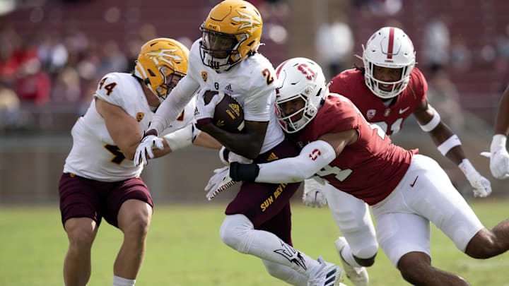 Oct 22, 2022; Stanford, California, USA; Arizona State Sun Devils wide receiver Elijhah Badger (2) is brought down by Stanford Cardinal linebacker Jacob Mangum-Farrar (14) after a pass reception during the first quarter at Stanford Stadium. Mandatory Credit: D. Ross Cameron-Imagn Images