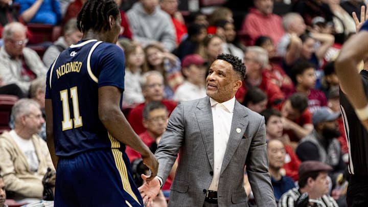 Feb 7, 2026; Stanford, California, USA;  Georgia Tech Yellow Jackets head coach Damon Stoudamire reacts as he talks with forward Baye Ndongo (11) during a timeout in the first half against the Stanford Cardinal at Maples Pavilion. Mandatory Credit: John Hefti-Imagn Images