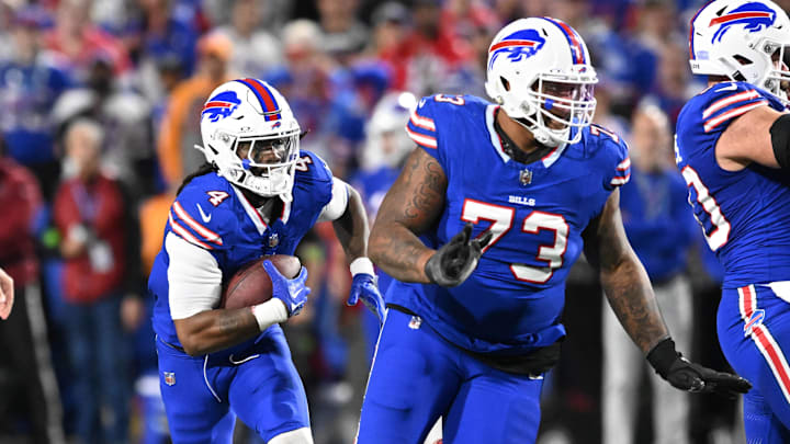Oct 26, 2023; Orchard Park, New York, USA; Buffalo Bills running back James Cook (4) follows a block by offensive tackle Dion Dawkins (73) in the second quarter against the Tampa Bay Buccaneers Oct 26, 2023; Orchard Park, New York, USA; Buffalo Bills running back James Cook (4) follows a block by offensive tackle Dion Dawkins (73) in the second quarter against the Tampa Bay Buccaneers