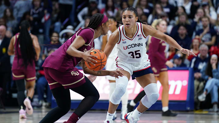 Nov 9, 2025; Storrs, Connecticut, USA; UConn Huskies guard Azzi Fudd (35) defends against Florida State Seminoles guard Sydney Bowles (11) in the second half at Harry A. Gampel Pavilion. Mandatory Credit: David Butler II-Imagn Images Nov 9, 2025; Storrs, Connecticut, USA; UConn Huskies guard Azzi Fudd (35) defends against Florida State Seminoles guard Sydney Bowles (11) in the second half at Harry A. Gampel Pavilion. Mandatory Credit: David Butler II-Imagn Images