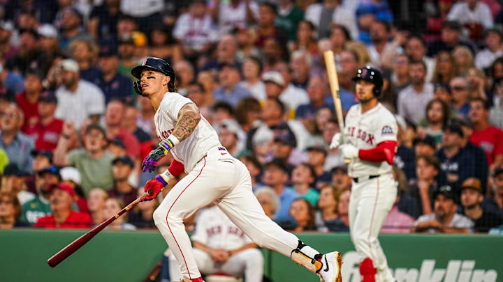 Aug 5, 2025; Boston, Massachusetts, USA; Boston Red Sox outfielder Jarren Duran (16) hits a double to drive in a run against the Kansas City Royals in the third inning at Fenway Park. Mandatory Credit: David Butler II-Imagn Images