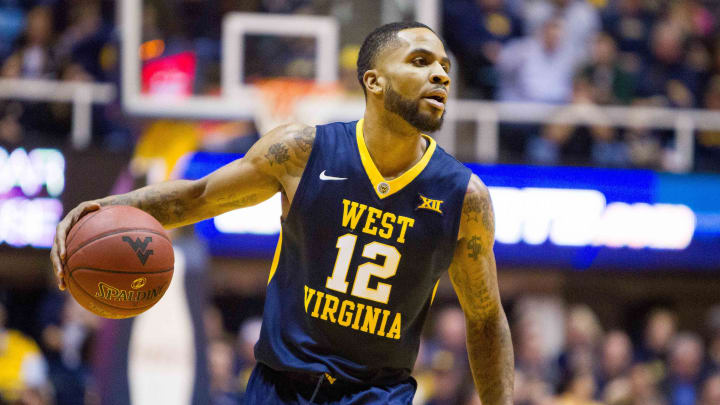 Mar 3, 2017; Morgantown, WV, USA; West Virginia Mountaineers guard Tarik Phillip (12) dribbles the ball during the first half against the Iowa State Cyclones at WVU Coliseum. 