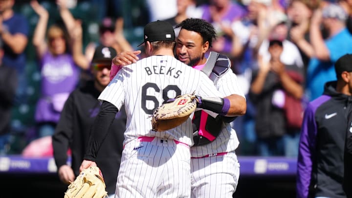 May 12, 2024; Denver, Colorado, USA; Colorado Rockies catcher Elias Díaz (35) and pitcher Jalen Beeks (68) celebrate defeating the Texas Rangers at Coors Field. Mandatory Credit: Ron Chenoy-USA TODAY Sports
