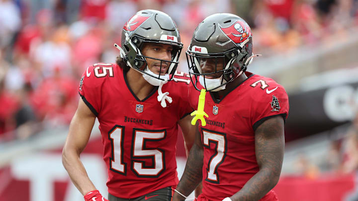 Tampa Bay Buccaneers wide receiver Jalen McMillan is congratulated by running back Bucky Irving.