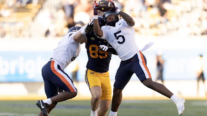 Nov 1, 2025; Berkeley, California, USA; Virginia Cavaliers linebacker Kam Robinson (5) intercepts a pass intended or California Golden Bears tight end Mason Mini (85) during the fourth quarter at California Memorial Stadium. Mandatory Credit: D. Ross Cameron-Imagn Images