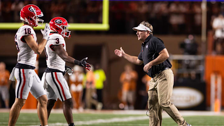 Oct 19, 2024; Austin, Texas, USA; Georgia Bulldogs head coach Kirby Smart celebrates with his players during the second quarter against the Texas Longhorns at Darrell K Royal-Texas Memorial Stadium. Mandatory Credit: Brett Patzke-Imagn Images