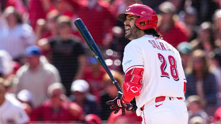 Cincinnati Reds third baseman Eugenio Suárez (28) watches as the ball flies on a three-run, go-ahed home run in the sixth inning of the MLB Interleague game between the Cincinnati Reds and the Boston Red Sox at Great American Ball Park in downtown Cincinnati on Sunday, March 29, 2026. The game was scoreless after three innings. The Reds won 3-2 to take the season-opening series from the Red Sox.