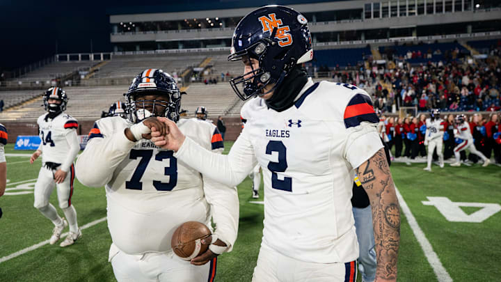 Nashville Christian's Jared Curtis (2) and Kenneth Harris (73) celebrate after defeating USJ in the Division II-A championship at Finley Stadium in Chattanooga, Tenn., Thursday, Dec. 4, 2025.