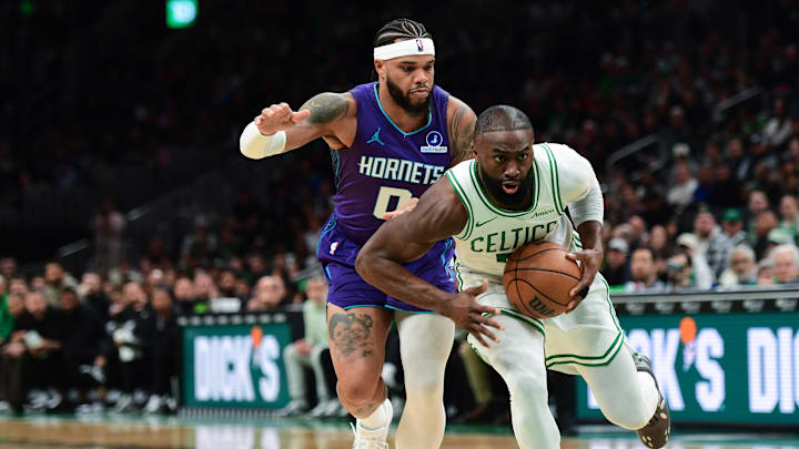 Boston Celtics guard Jaylen Brown (7) controls the ball while Charlotte Hornets forward Miles Bridges (0) defends