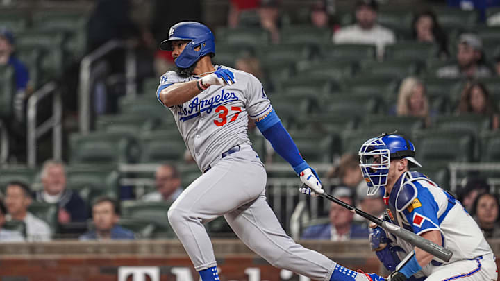 May 3, 2025; Cumberland, Georgia, USA; Los Angeles Dodgers right fielder Teoscar Hernandez (37) singles to drive in a run against the Atlanta Braves during the third inning at Truist Park. Mandatory Credit: Dale Zanine-Imagn Images