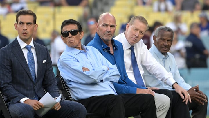 Los Angeles Dodgers play-by-play broadcast announcer Joe Davis sits with former players Fernando Valenzuela, Kirk Gibson, Orel Hershiser and Manny Mota as they listen as Dusty Baker is inducted into the Dodgers Hall of Legends prior to the game against the the Pittsburgh Pirates at Dodger Stadium on Aug. 9, 2024. Los Angeles Dodgers play-by-play broadcast announcer Joe Davis sits with former players Fernando Valenzuela, Kirk Gibson, Orel Hershiser and Manny Mota as they listen as Dusty Baker is inducted into the Dodgers Hall of Legends prior to the game against the the Pittsburgh Pirates at Dodger Stadium on Aug. 9, 2024.