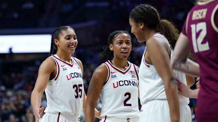 Nov 9, 2025; Storrs, Connecticut, USA; UConn Huskies guard Azzi Fudd (35) and guard Kk Arnold (2) react with forward Sarah Strong (21) after a play against the Florida State Seminoles in the first half at Harry A. Gampel Pavilion. Mandatory Credit: David Butler II-Imagn Images