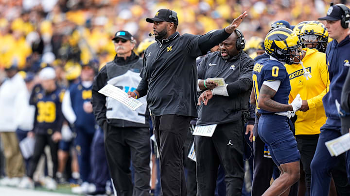 Michigan head coach Sherrone Moore calls a play against Texas during the first half at Michigan Stadium in Ann Arbor on Saturday, September 7, 2024.