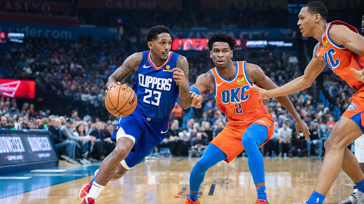Dec 22, 2019; Oklahoma City, Oklahoma, USA; LA Clippers guard Lou Williams (23) drives to the basket against Oklahoma City Thunder guard Shai Gilgeous-Alexander (2) during the first quarter at Chesapeake Energy Arena. Mandatory Credit: Rob Ferguson-Imagn Images