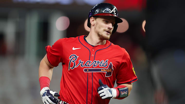 Atlanta Braves catcher Sean Murphy (12) hits a two-run home run against the Kansas City Royals in the fourth inning at Truist Park in 2024.