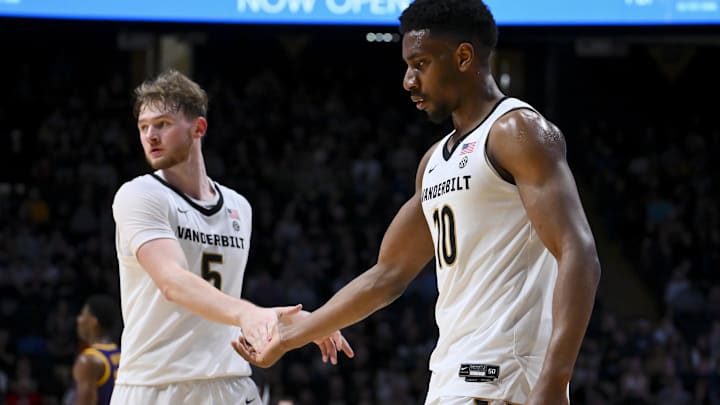 Jan 10, 2026; Nashville, Tennessee, USA;  Vanderbilt Commodores forward Tyler Nickel (5) gives five to forward Ak Okereke (10) after the steal against the Louisiana State Tigers during the second half at Memorial Gymnasium. Mandatory Credit: Steve Roberts-Imagn Images