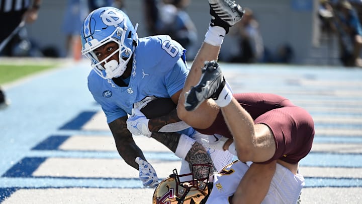 Sep 16, 2023; Chapel Hill, North Carolina, USA; North Carolina Tar Heels wide receiver Nate McCollum (6) catches a touchdown pass as Minnesota Golden Gophers defensive back Aidan Gousby (7) defends in the first quarter at Kenan Memorial Stadium. Mandatory Credit: Bob Donnan-USA TODAY Sports