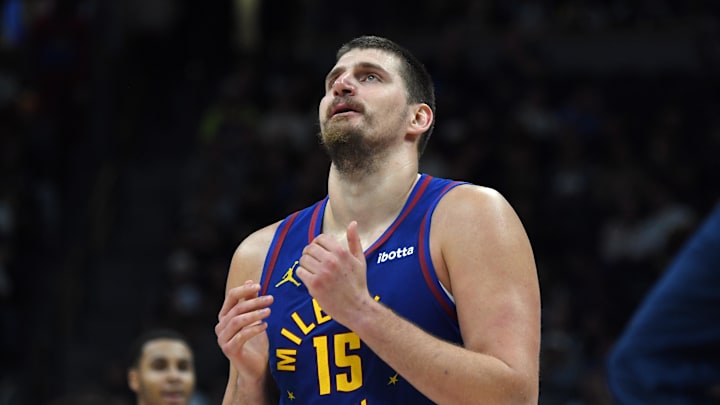 Nov 22, 2025; Denver, Colorado, USA; Denver Nuggets center Nikola Jokic (15) walks back to the bench during a timeout while trailing during the second half against the Sacramento Kings at Ball Arena. Nov 22, 2025; Denver, Colorado, USA; Denver Nuggets center Nikola Jokic (15) walks back to the bench during a timeout while trailing during the second half against the Sacramento Kings at Ball Arena.