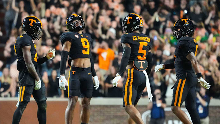 Nov 2, 2024; Knoxville, Tennessee, USA; Tennessee Volunteers defensive back Andre Turrentine (2) celebrates with defensive back Jakobe Thomas (9), defensive back Christian Harrison (5), and defensive back Jalen McMurray (6) after making an interception against the Kentucky Wildcats) during the first half at Neyland Stadium.. Mandatory Credit: Caitie McMekin/USA TODAY Network via Imagn Images