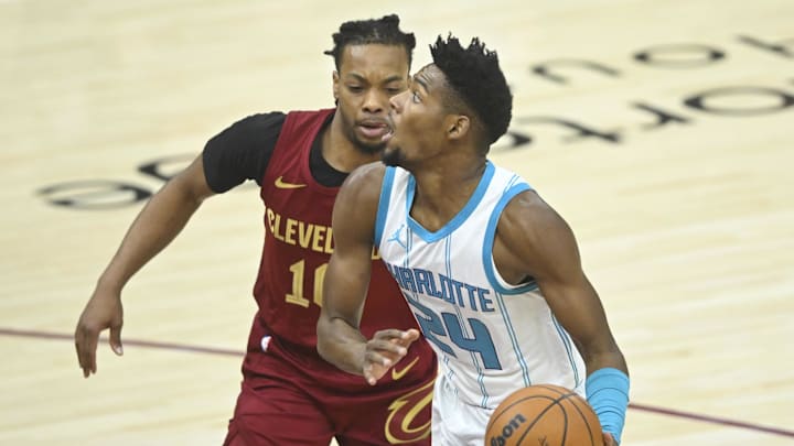 Jan 5, 2025; Cleveland, Ohio, USA; Charlotte Hornets forward Brandon Miller (24) drives against Cleveland Cavaliers guard Darius Garland (10) in the first quarter at Rocket Mortgage FieldHouse. Mandatory Credit: David Richard-Imagn Images