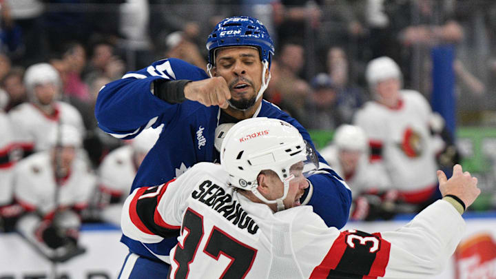 Sep 22, 2024; Toronto, Ontario, CAN;  Toronto Maple Leafs forward Ryan Reaves (75) fights with Ottawa Senators defenseman Donovan Sebrango (37) in the second period at Scotiabank Arena. Mandatory Credit: Dan Hamilton-Imagn Images
